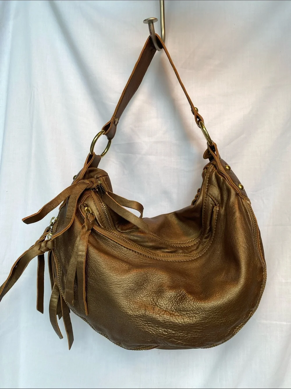 Abro Bronze Leather Hobo Bag with Tassel Detail and seqin accent